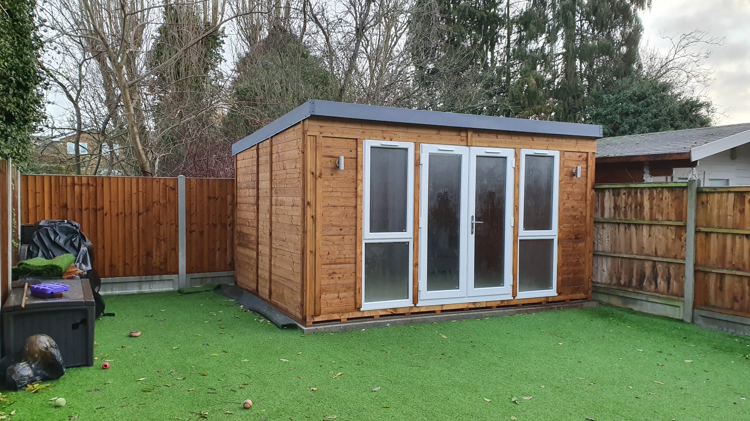Finished garden room exterior in Southend-on-Sea with timber cladding and glazed doors