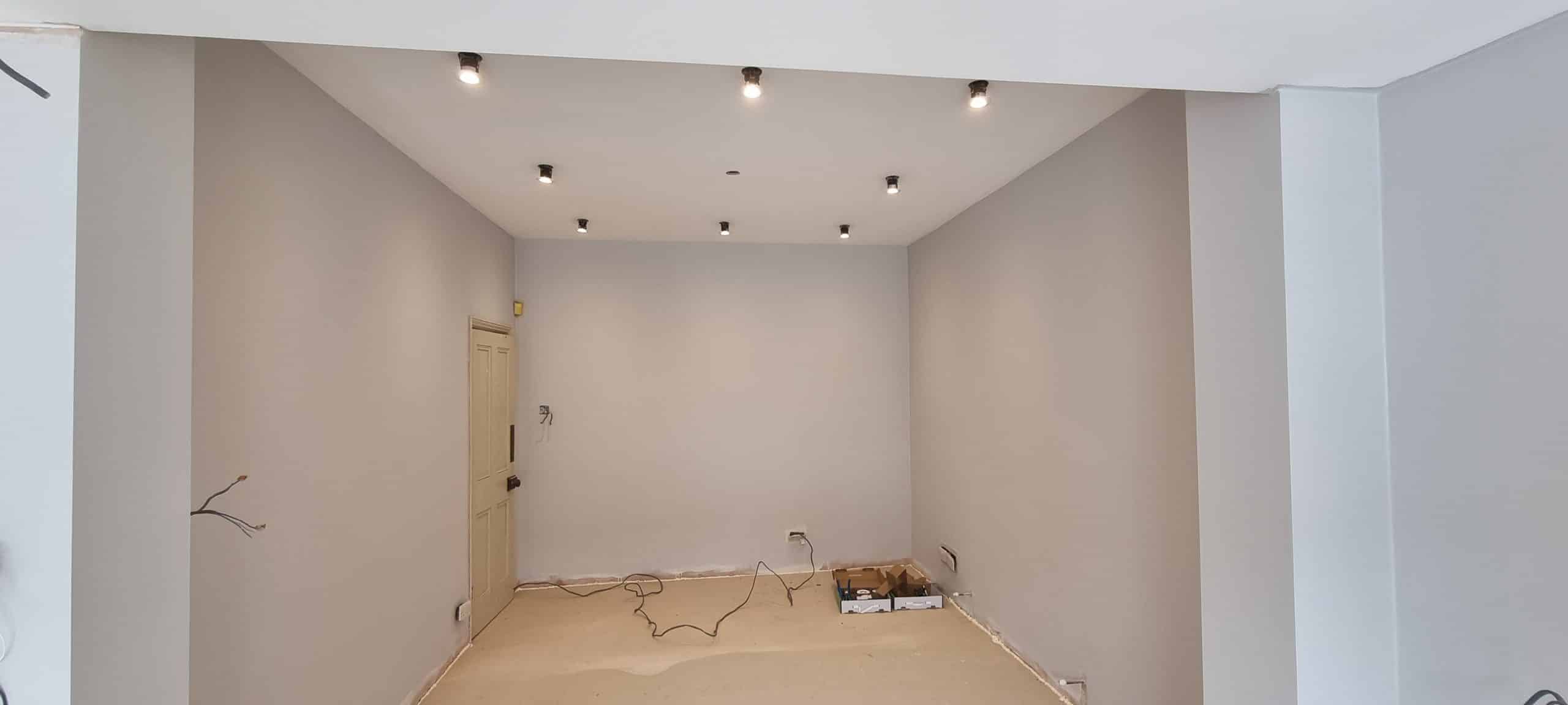 btom-construction-kitchen-extension-skylight-installation-southend Open plan extension space after plastering Southend